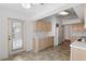 Bright kitchen featuring wood cabinets, white countertops, and a stainless steel refrigerator at 9064 Sw 91St Cir, Ocala, FL 34481