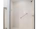 Bright tiled shower with safety bar at 9064 Sw 91St Cir, Ocala, FL 34481