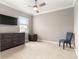 Bedroom featuring a ceiling fan, TV and window for great natural light at 9085 Sw 89Th Loop, Ocala, FL 34481