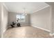 Dining room features tiled floors, a modern chandelier and bright natural light at 9085 Sw 89Th Loop, Ocala, FL 34481