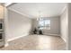 Bright dining area with tiled floors, chandelier, and adjacent exercise area at 9085 Sw 89Th Loop, Ocala, FL 34481