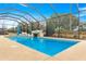 Gorgeous screened-in pool offers a tranquil retreat with serene views at 9085 Sw 89Th Loop, Ocala, FL 34481