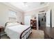 Sunlit bedroom featuring neutral walls, a ceiling fan, and a comfortable bed at 9167 Sw 99Th Court Rd, Ocala, FL 34481