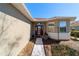 Close-up highlighting the inviting front door and surrounding landscape details at 9167 Sw 99Th Court Rd, Ocala, FL 34481