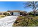 Inviting single-story home featuring a two-car garage and well-maintained landscaping at 9167 Sw 99Th Court Rd, Ocala, FL 34481