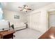 Bright bedroom features a ceiling fan, neutral paint, and double closets at 9335 Sw 85Th Ter # A, Ocala, FL 34481