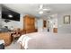 Bedroom featuring a large bed and wooden furniture with a connecting bath at 9335 Sw 85Th Ter # A, Ocala, FL 34481