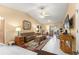 Comfortable living room features neutral colored walls, tile floors and access to a bonus room at 9335 Sw 85Th Ter # A, Ocala, FL 34481