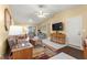 Comfortable living room features neutral colored walls, tile floors and access to a bonus room at 9335 Sw 85Th Ter # A, Ocala, FL 34481