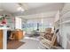 Comfortable sunroom featuring neutral carpet, lots of light, and a ceiling fan at 9335 Sw 85Th Ter # A, Ocala, FL 34481