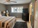 Bedroom with a dark color scheme, fan, dresser and an ensuite bathroom at 9535 Sw 85Th Ter # C, Ocala, FL 34481