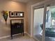 Hallway with dark cabinet, decorative flower vase and sliding glass doors leading to a patio at 9535 Sw 85Th Ter # C, Ocala, FL 34481