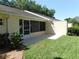 This property boasts a private back patio, perfect for relaxing and entertaining, with a screened in sunroom at 9652 Sw 84Th Ter # C, Ocala, FL 34481