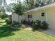 Well-maintained backyard featuring healthy green grass, landscaping and a patio at 9652 Sw 84Th Ter # C, Ocala, FL 34481