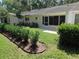 This property has a beautiful backyard with a well-maintained lawn and privacy due to the bushes and mature trees at 9652 Sw 84Th Ter # C, Ocala, FL 34481