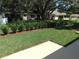 Spacious well-maintained backyard featuring healthy green grass and decorative landscape at 9652 Sw 84Th Ter # C, Ocala, FL 34481