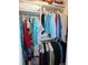 Organized closet with shelving and rods, filled with clothes and accessories, providing ample storage space at 9652 Sw 84Th Ter # C, Ocala, FL 34481