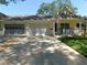 Charming home with a well-manicured lawn, two-car garage, and front porch at 9652 Sw 84Th Ter # C, Ocala, FL 34481