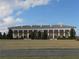 Impressive building featuring stately architecture, manicured landscaping at 9652 Sw 84Th Ter # C, Ocala, FL 34481