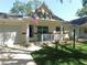 This charming one-story villa has a cozy front porch with a white picket fence, and an attached garage at 9652 Sw 84Th Ter # C, Ocala, FL 34481
