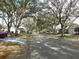 Scenic street view showcasing the well-manicured lawns and tree-lined street at 9652 Sw 84Th Ter # C, Ocala, FL 34481