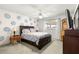 Bedroom featuring a bed, dresser, and ceiling fan at 9866 Sw 97Th Ln, Ocala, FL 34481