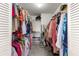 Walk-in closet with ample storage space with racks and shelving to store clothing at 9866 Sw 97Th Ln, Ocala, FL 34481