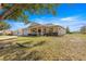 Charming single-story home with a welcoming front porch and well-manicured lawn at 9866 Sw 97Th Ln, Ocala, FL 34481