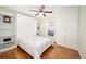 Cozy bedroom featuring a Murphy bed, built-in shelving, and a window with natural light at 9983 Sw 90Th Loop, Ocala, FL 34481