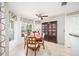 Bright dining area with classic china cabinet and large windows for great light at 9983 Sw 90Th Loop, Ocala, FL 34481