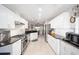 Spacious kitchen featuring stainless steel appliances, granite counters, and tile flooring at 9983 Sw 90Th Loop, Ocala, FL 34481