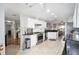 Open kitchen layout featuring granite counters, stainless appliances, and ample cabinet space at 9983 Sw 90Th Loop, Ocala, FL 34481