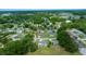 Wide aerial view showcasing a neighborhood with tree-lined streets and well-maintained single-Gathering homes at 10821 Sw 87Th Ter, Ocala, FL 34481
