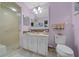 Bathroom featuring lilac walls, a white vanity, and a glass-enclosed shower at 10821 Sw 87Th Ter, Ocala, FL 34481