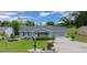 Charming single-story home with well-manicured lawn and attached two-car garage at 10821 Sw 87Th Ter, Ocala, FL 34481