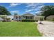 Charming single-story home with well-manicured front lawn and attached two-car garage at 10821 Sw 87Th Ter, Ocala, FL 34481