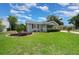 Charming single-story home with well-manicured front lawn and landscape at 10821 Sw 87Th Ter, Ocala, FL 34481