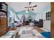 Bright home office with vaulted ceilings, natural light, and a ceiling fan at 10821 Sw 87Th Ter, Ocala, FL 34481