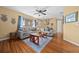 Cozy living room featuring hardwood floors and a comfortable seating area, perfect for relaxation at 10821 Sw 87Th Ter, Ocala, FL 34481