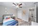 Bedroom with a ceiling fan, a closet, and a view into the dining room at 11 Locust Trak, Ocala, FL 34472