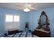 Bedroom featuring white shuttered window and antique vanity at 11091 Sw 73Rd Ct, Ocala, FL 34476