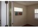 Well-lit room featuring decorative door and an accent window for extra light at 11091 Sw 73Rd Ct, Ocala, FL 34476