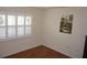 Bedroom with hardwood floors and plantation shutters for natural light at 11091 Sw 73Rd Ct, Ocala, FL 34476