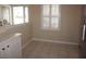 Bright breakfast nook features plantation shutters and neutral tiled flooring at 11091 Sw 73Rd Ct, Ocala, FL 34476