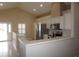 Bright kitchen boasts stainless steel appliances, white cabinetry, and a tiled backsplash at 11091 Sw 73Rd Ct, Ocala, FL 34476