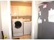 Laundry room with washer, dryer, and storage cabinets at 11091 Sw 73Rd Ct, Ocala, FL 34476