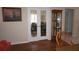 Dining area features double doors to an office and a display cabinet near the kitchen at 11091 Sw 73Rd Ct, Ocala, FL 34476