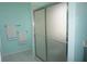 Modern bathroom with a glass-enclosed shower and tiled floor at 11091 Sw 73Rd Ct, Ocala, FL 34476
