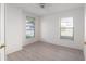 Bright bedroom featuring new floors, natural lighting, and a ceiling fan at 11625 Sw 71St Cir, Ocala, FL 34476