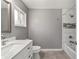 Stylish bathroom featuring modern fixtures, a vanity, and a shower-tub combination at 165 Ne 43Rd Ave, Ocala, FL 34470